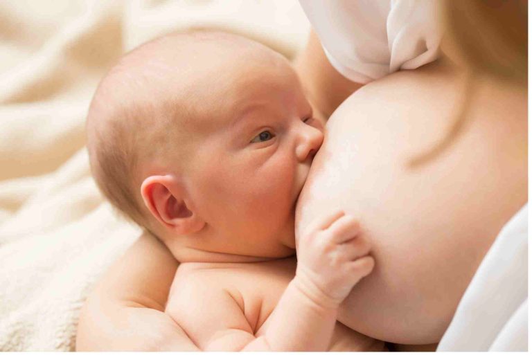 baby breastfeeding with eyes open