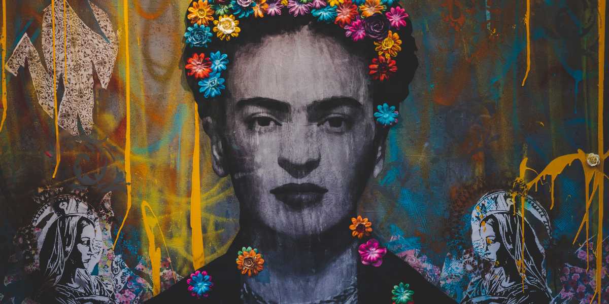 painting of woman with flowers braided into the hair on wall