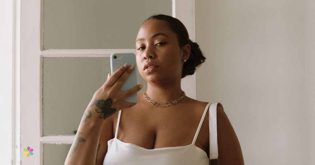 woman taking a selfie with delicate smile